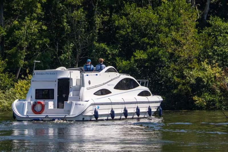 Brinks Prelude looking serene on calm waters in the Norfolk Broads